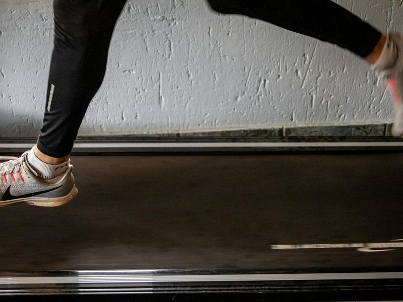 Person in a dynamic fluid motion during an exercise routine.